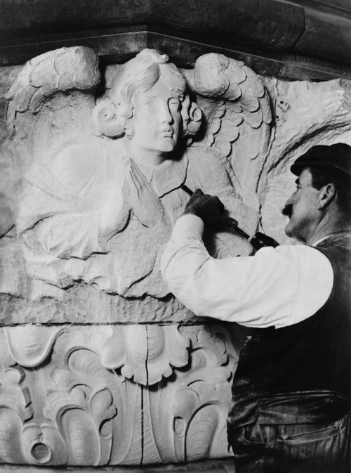Stonemason finishing an angel, 1909
